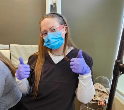 dental assistant student posing for a photo in class