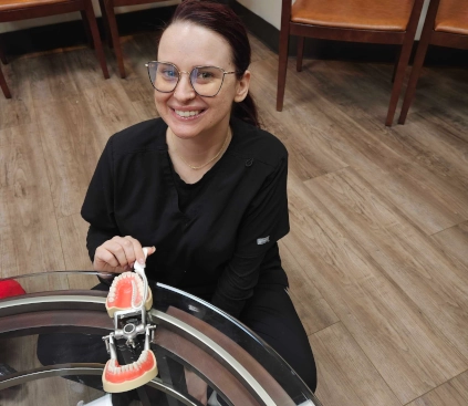 Dental assistant student smiling during lab training