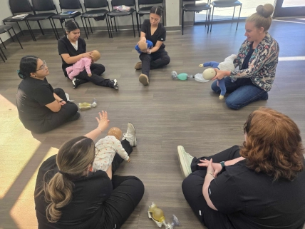 Instructor at Odessa DAS demonstrating CPR methods with students observing and participating 