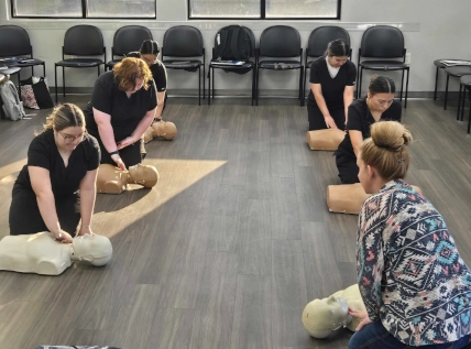  Wide shot of the classroom with Odessa DAS students engaged in CPR training during Week 4 lab 