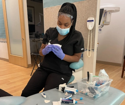  AM class student at Pearland DAS setting up materials for temporary crown fabrication 