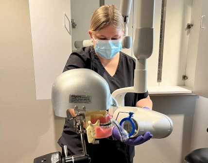  Two students at Waco Dental Assistant School working side-by-side during a temporary crown lab 