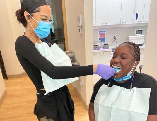 Dental assistant student training at Dallas Dental Assistant School