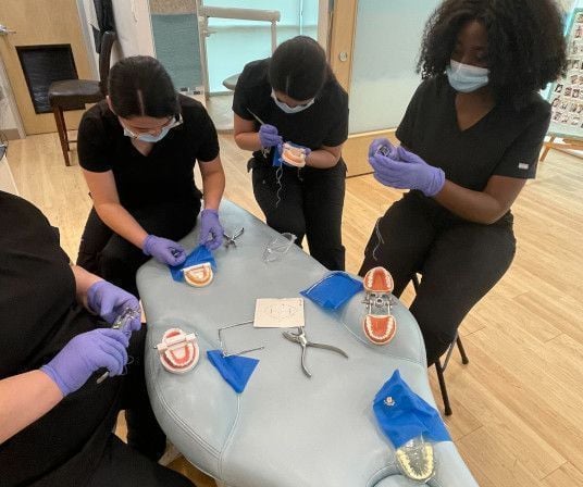 Dental assistant student training at Fort Wayne Dental Assistant School