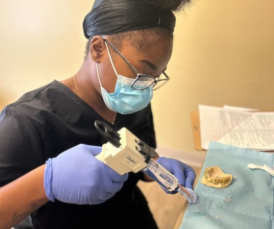 Dental assistant student training at Savannah Dental Assistant School