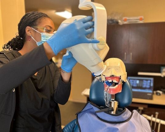 Dental assistant student training at Fairfax Dental Assistant School