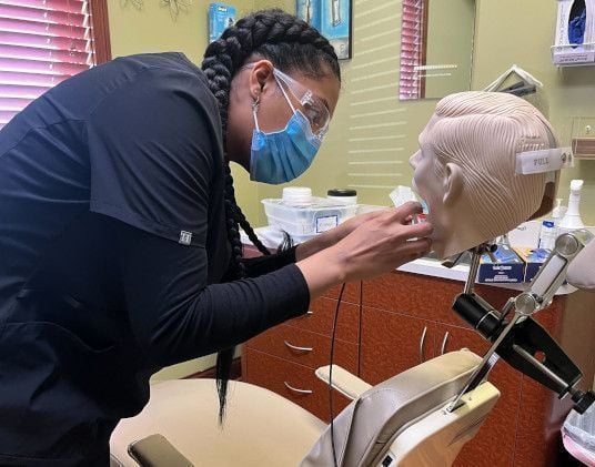 Dental assistant student training at Charlotte Dental Assistant School