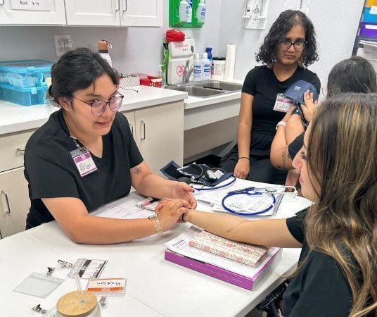 Medical assistant student training at Las Cruces Medical Assistant School