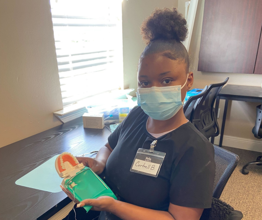 Dental assistant student training at Savannah Dental Assistant School