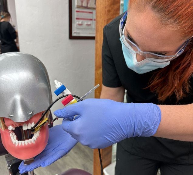 Dental assistant student training at Provo Dental Assistant School